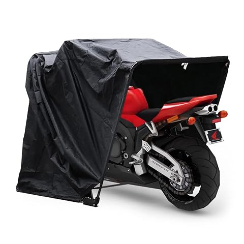 Abri pliable Jolre en toile Oxford noire et cadre acier, installé au-dessus d’une moto dans un jardin