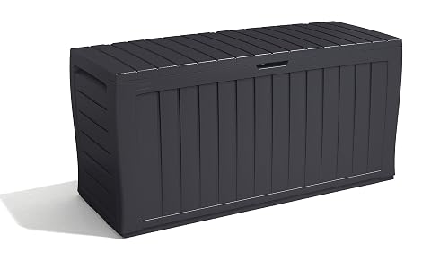 Coffre de jardin Keter Marvel+ gris graphite posé sur une terrasse près de végétation