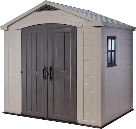 Abri de jardin Keter taupe et beige avec portes doubles, fenêtres fixes et lucarne