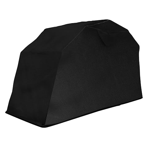Tente de garage moto noire avec cadre en acier, installée dans un jardin calme autour d’une moto.