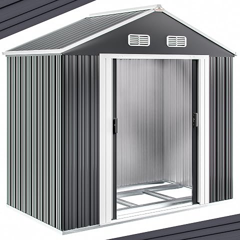 Abri de jardin en métal anthracite à toit double pente, installé sur un sol gravillonné